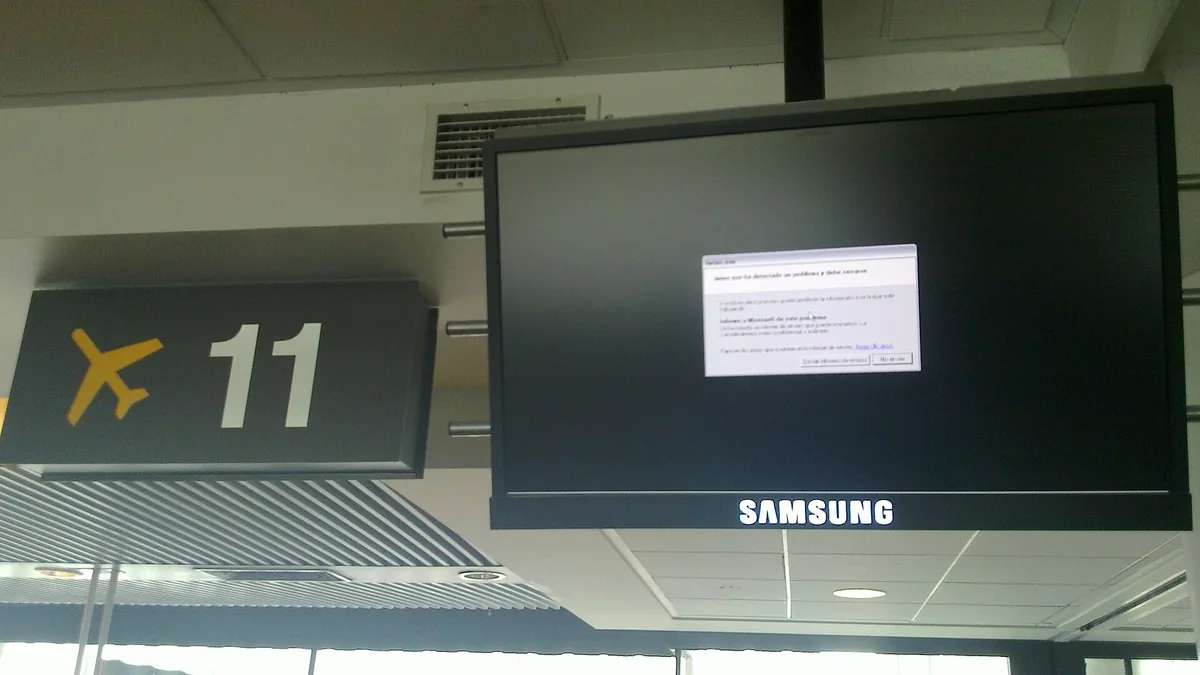 A public display screen showing an unhandled software error message